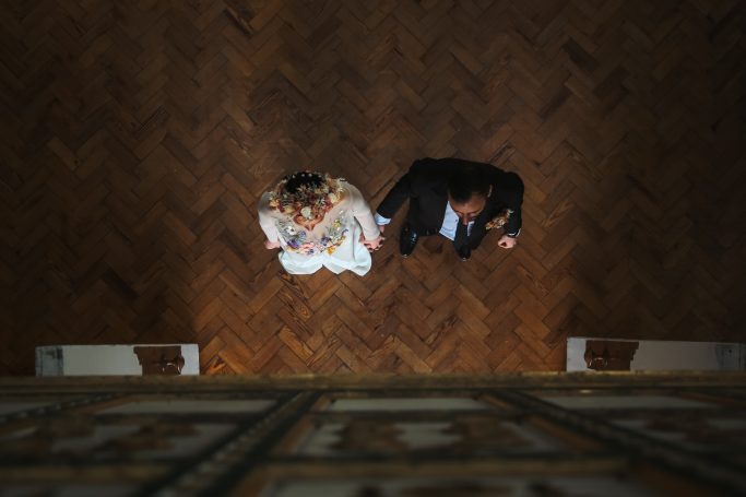 Aerial photo of a couple leaving the wedding venue