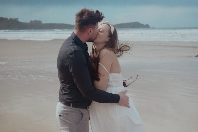 Couple kissing on the beach