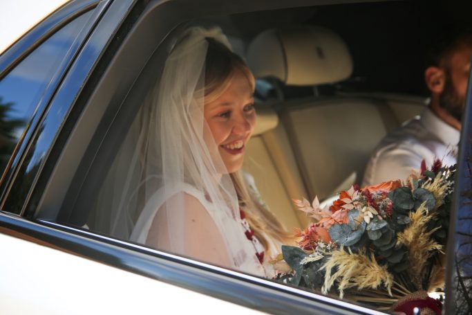 Bride going to wedding in a Rolls Royce